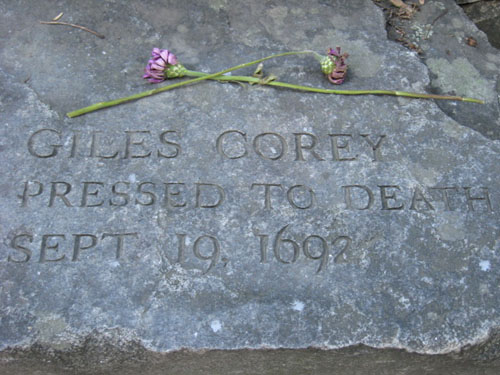 The Giles Corey memorial stone at the Salem Witch Trials Memorial.